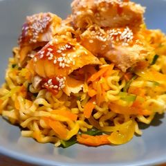 A picture of Sweet chili noodles with salmon.