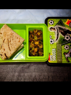 A picture of Roti with brinjal aloo fry.