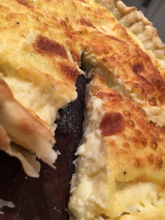 Una foto de Tarta de queso y cebolla. Riquísima