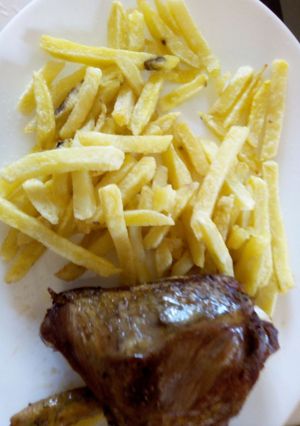 A picture of Chips served with Grilled Chicken.