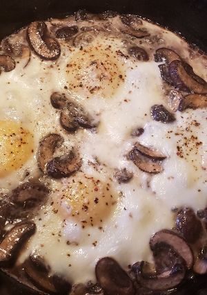 A picture of Baked Eggs with Mushrooms and Cheese.