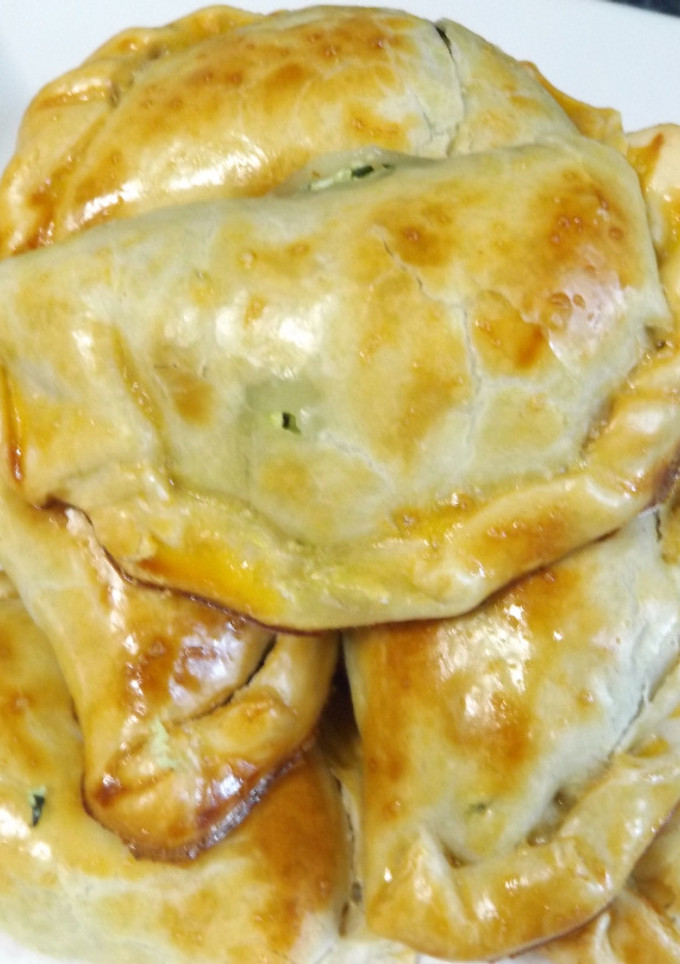 Una foto de Empanadas de espinacas, ricotta y lacón
