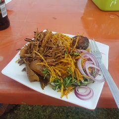 A picture of Abacha with ugba and pomo and fish.