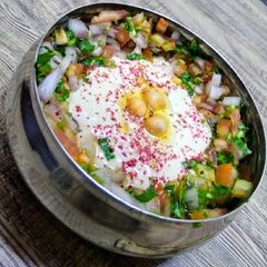 A picture of Baba ganouj salad compliment with vegetables.