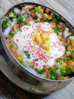 A picture of Baba ganouj salad compliment with vegetables.