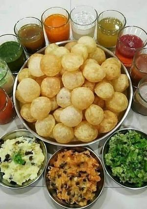 A picture of Pani Puri in ten flavors Homemade.
