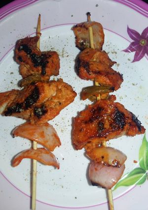 A picture of Chicken tikka made in a pan.