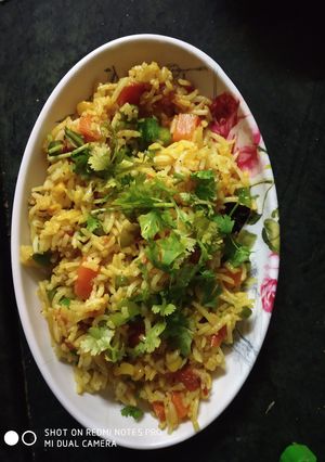 A picture of Corn and capsicum pulao.