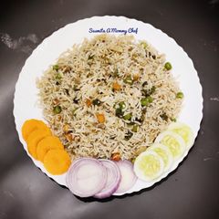 A picture of Hotel style veg fried rice with tricolour salad.