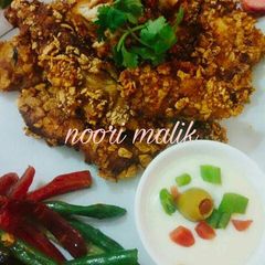 A picture of Corn_fried_chicken and garlic_sauce.