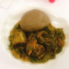 A picture of Vegetable soup and amala.