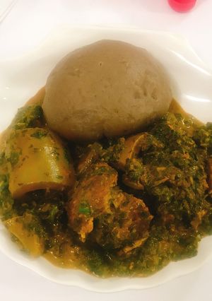 A picture of Vegetable soup and amala.