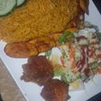 Jollof and chicken with salad and plantain