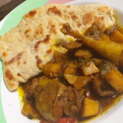 Jamaican chicken curry and chapati A picture of Jamaican chicken curry and chapati.