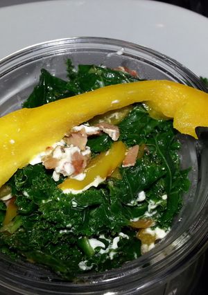 A picture of Sauted kale with Rosemary herbed ham and goat cheese.