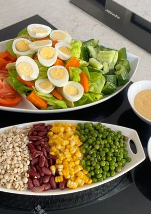 A picture of Boiled Eggs Salad Mini Bar with Spicy Yogurt Salad Dressing.