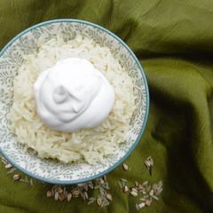 A picture of Rice topped with Greek Yogurt.