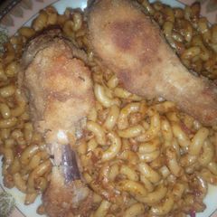 A picture of Macroni with chicken drum stick.