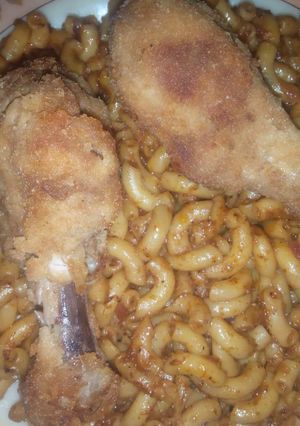 A picture of Macroni with chicken drum stick.