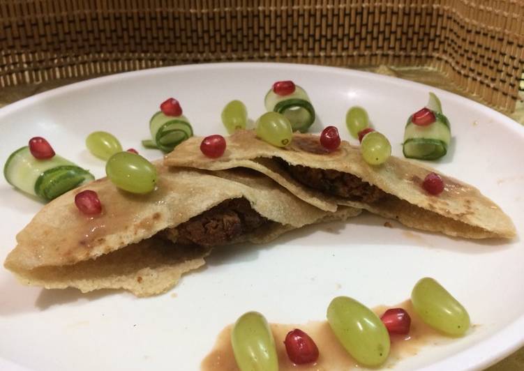 Stuffed pita bread with stuffed cauliflower kababs served with pomegranate grape sauce