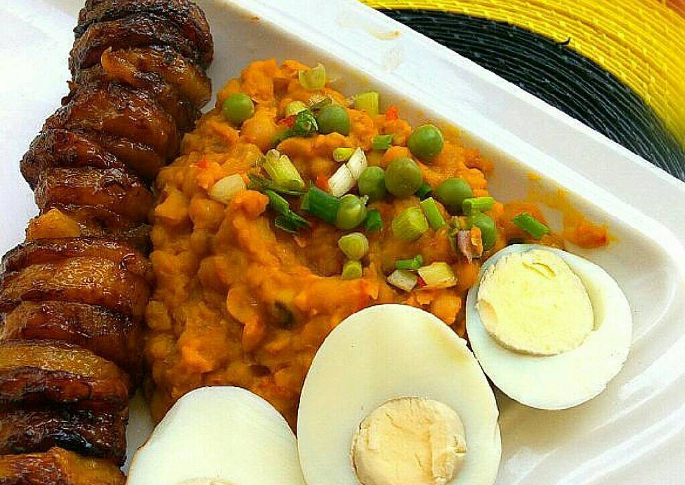 Beans paired with fried plantains and hard boiled eggs