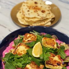 A picture of Eggplant with haloumi, beetroot, tzatziki and yogurt flatbreads.