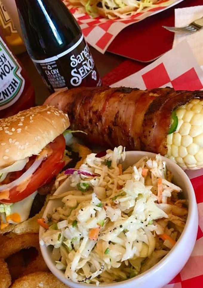 A picture of Bacon wrapped corn on the cobb.