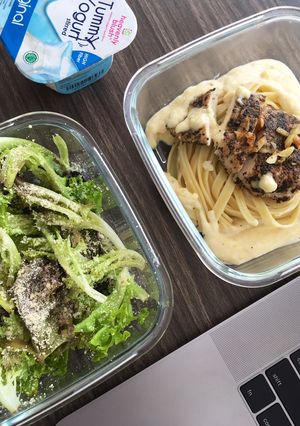 A picture of Chicken Basil Alfredo Pasta and Salad.