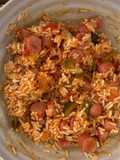Arroz con fritada y salchichas