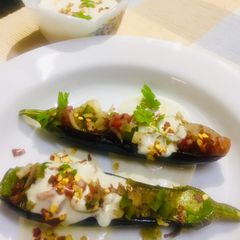A picture of Roasted eggplants with walnut cheese sauce.