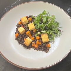 A picture of Smoked tofu with a puy lentils and warm chilli salad.