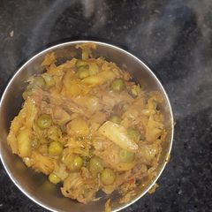 A picture of Aloo patta gobhi matar.