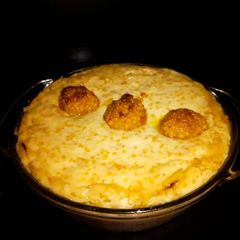 A picture of Baked yogurt with ladoo.