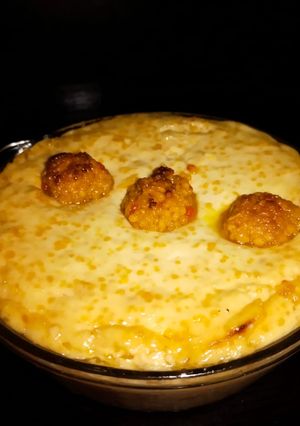 A picture of Baked yogurt with ladoo.