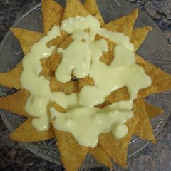 A picture of Nachos with Cheese Dip.