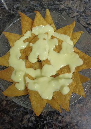 A picture of Nachos with Cheese Dip.