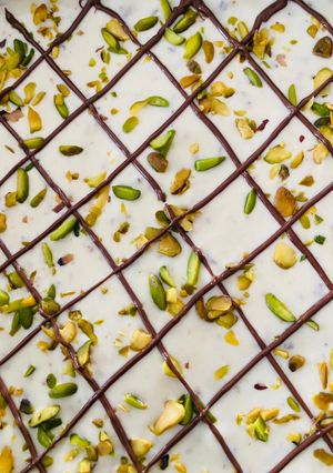 A picture of Pistachios, cranberries and almond fudge.