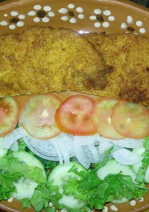 Una foto de Milanesa navideña a la Mario, s
