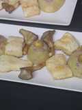 Merluza con setas ostra y patatas rellenas