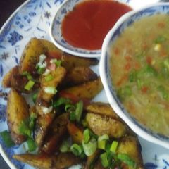 A picture of Roasted potatoes with soup.