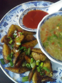 A picture of Roasted potatoes with soup.