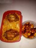 Jollof rice with chicken and fried plantain