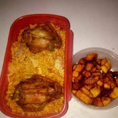 Jollof rice with chicken and fried plantain A picture of Jollof rice with chicken and fried plantain.