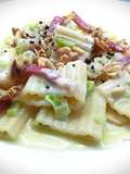 Mezzi paccheri ondulati con crema di gorgonzola, speck, noci e pinoli