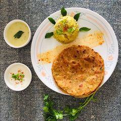 A picture of Khichadi kadhi thepla.
