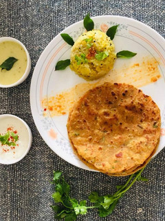 A picture of Khichadi kadhi thepla.