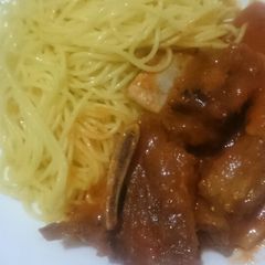 A picture of Ribs in sauce.