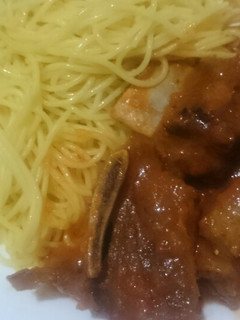 A picture of Ribs in sauce.