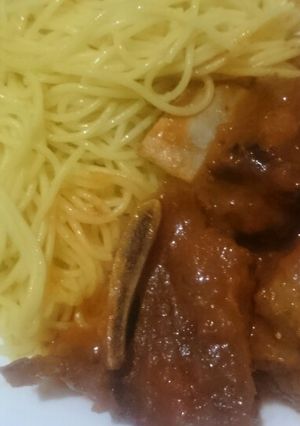 A picture of Ribs in sauce.