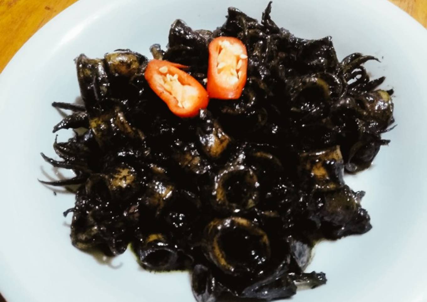 Ngagiling cumi hideung anggang